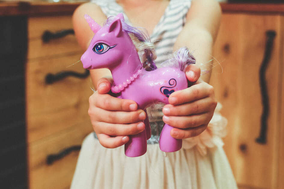 kaboompics.com_Child holding unicorn toy