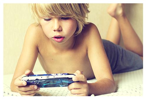 Boy Playing PSP 500x341